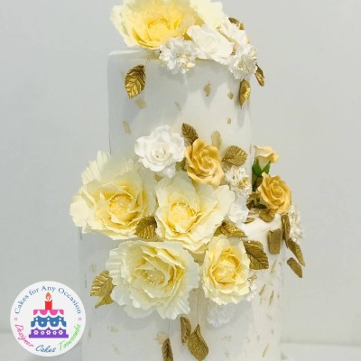 White and Gold Rose Wedding Cake.jpg